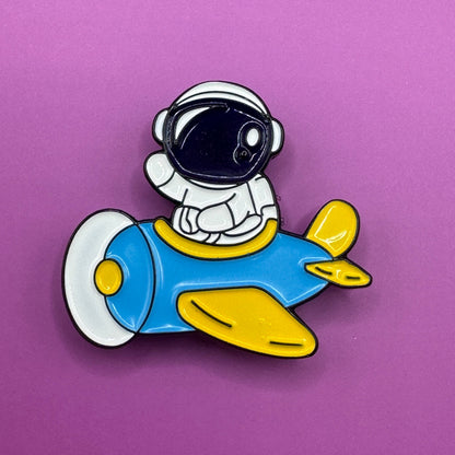 Astronaut airplane enamel pin