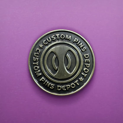Gunmetal Finish Logo Coin on Purple Background
