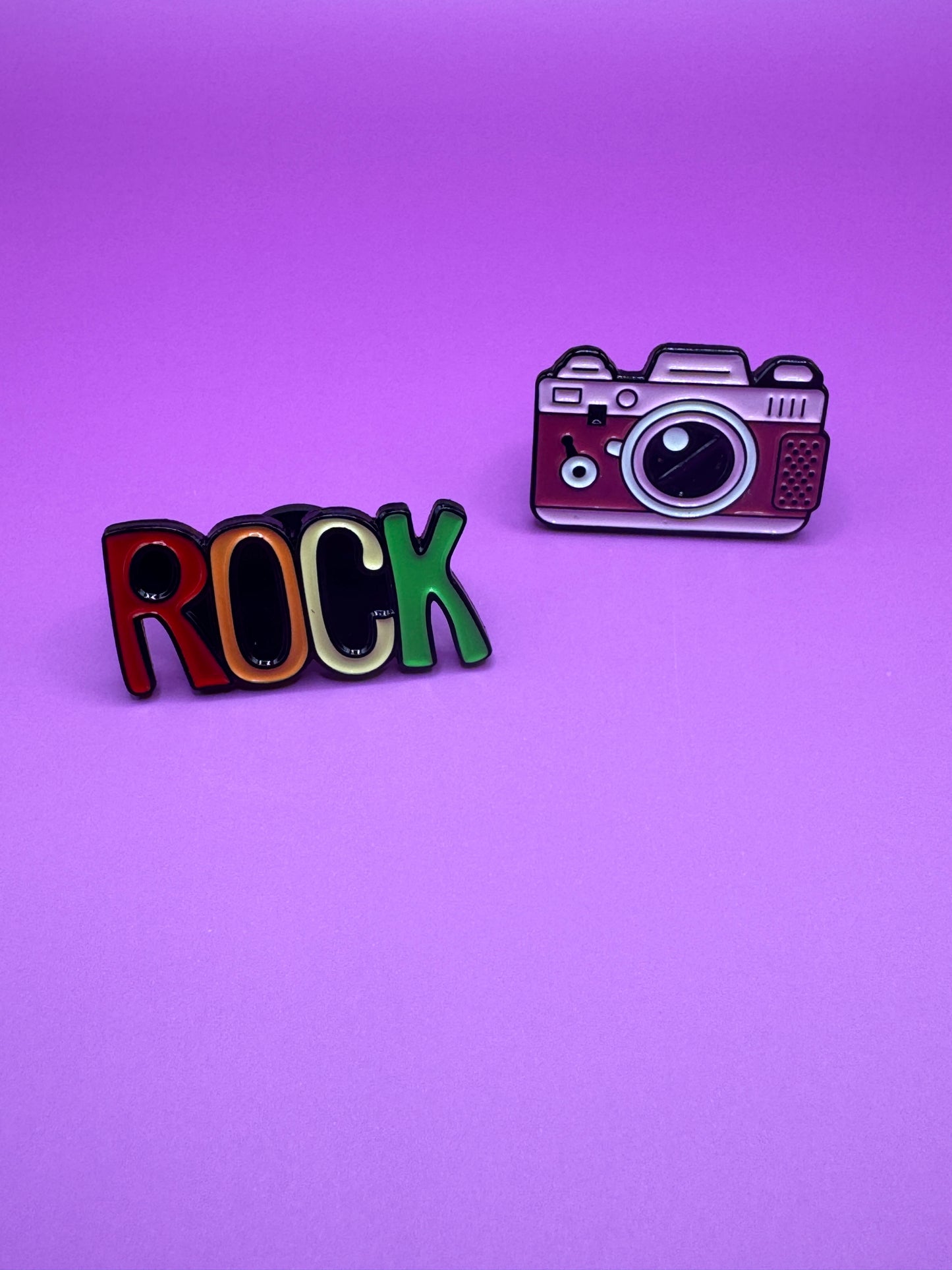 Rock text and camera enamel pins